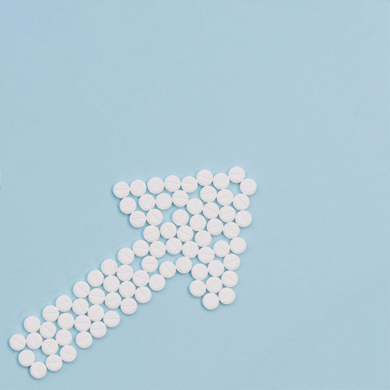 white-pills-forming-arrow